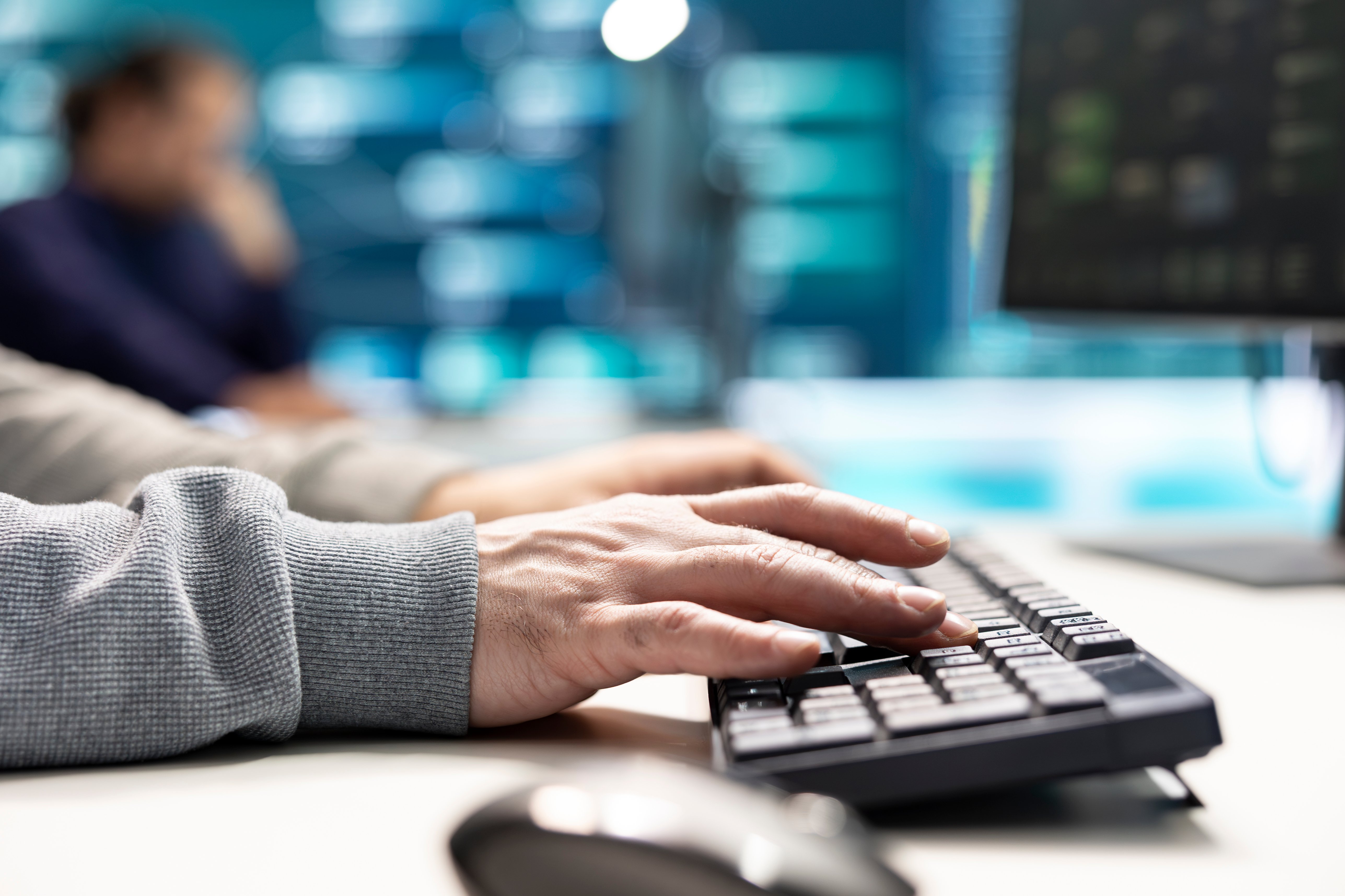 governmental-it-expert-monitoring-cyber-threats-computer-big-screen